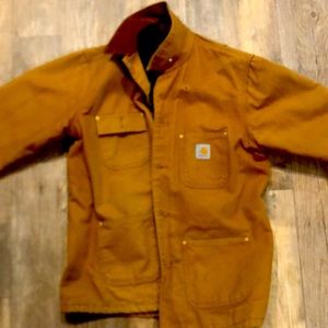Carharrt wool lined coat has one small hole by shoulder but in like new shape